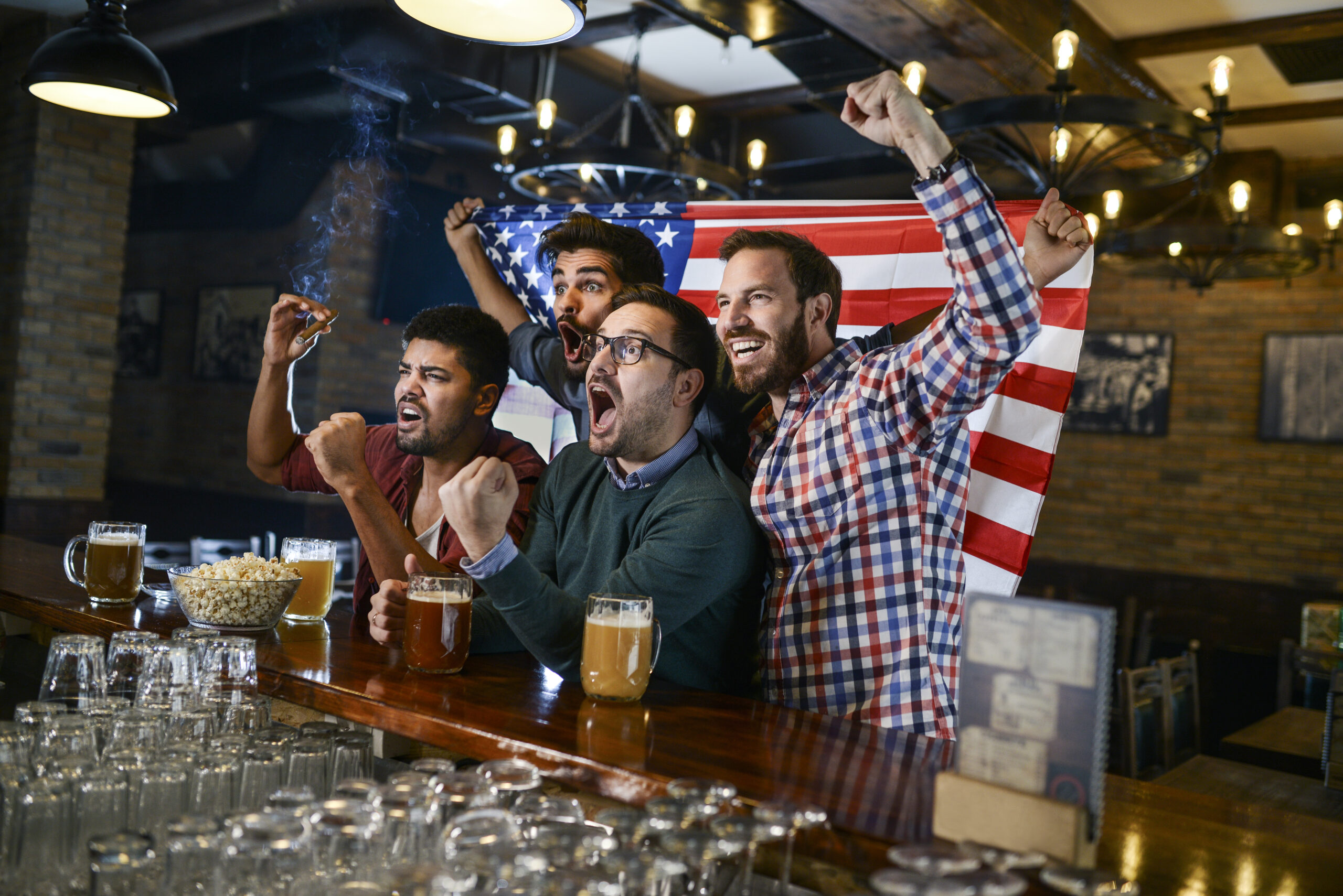 Friends in bar watching game best sportsbook Albuquerque